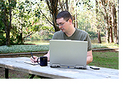 Image: male student working on a computer