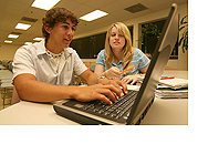 Image: students with a laptop computer
