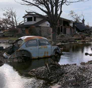 New Orleans flood damage showing car and buildings